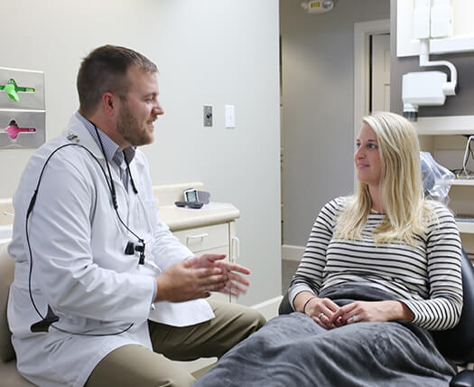 Dr. Renz speaking with a patient